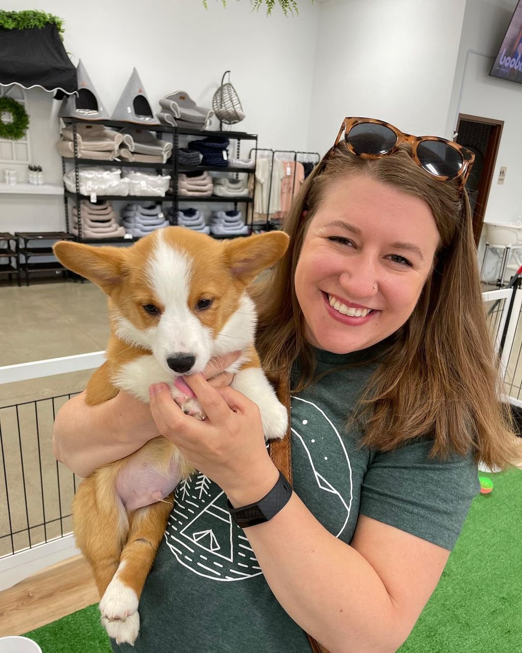 Couple with red and white Corgi in urban setting